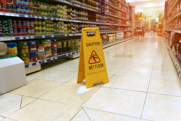 Wet floor caution sign in store